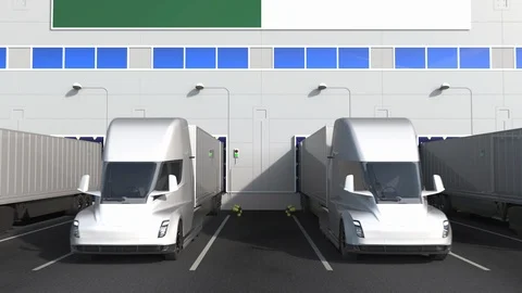Electric trailer trucks at warehouse loading dock with flag of ALGERIA. Algerian Stock Footage 125523519