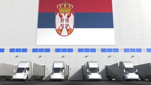 Electric trailer trucks at warehouse loading dock with flag of SERBIA. Serbian Stock Illustration