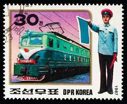 Electric Train and Traffic Controller on postage stamp Stock Photos