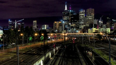 Electric train at dusk heading away from Melbourne Stock Footage 27794901