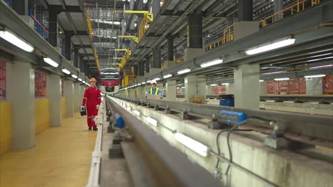 Electric train engineer and technician with tools inspect the railway Stock Footage 253818097