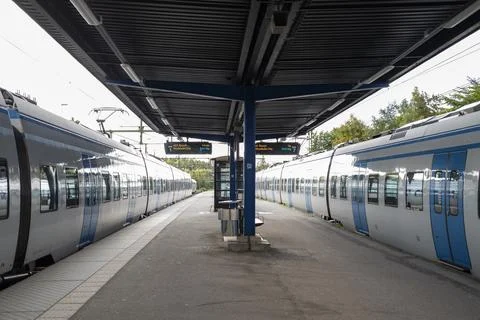 Electric train high-speed train to the city center on the railway station Stock Photos