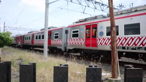 The electric train is on its way. Java, Indonesia on October 2, 2022 Stock Footage 224454493