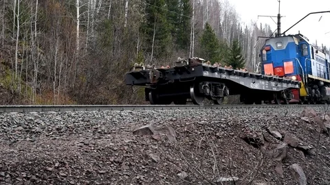 Electric train moves on rails in the spring outdoors Video stock 106014565