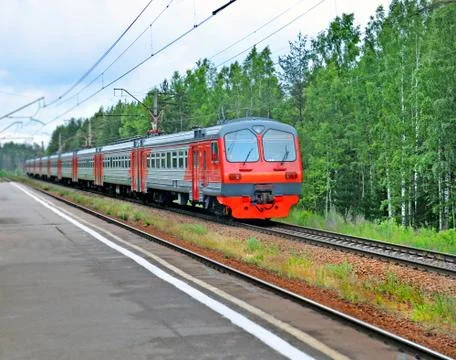 Electric train moving past the platform Stock Photos