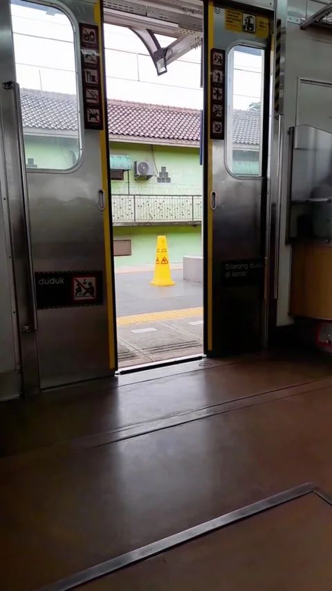 An electric train or commuter line door starts to close automatically Stock Footage 285020376