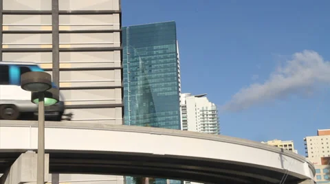 Electric Train passes by building, mass transportation in Miami, Florida Stock Footage 36640561