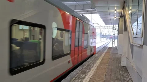 An electric train passes by the platform at the station in Moscow Stock Footage 170563601
