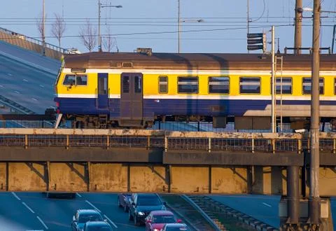 Electric train passing the bridge over Daugava in Riga 写真素材