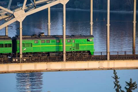 Electric train passing the bridge over Daugava in Riga Fotos de archivo