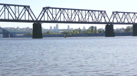 Electric train ride across the river over the bridge. Stock Footage 37874525
