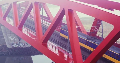 Electric train running on a bridge over a river Video stock 81533179