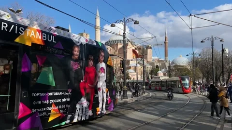 Electric trams run in front of Hagia Sophia, Istanbul, Turkey 4K Stock Footage 169873376