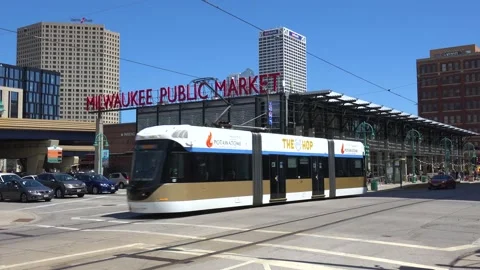 Electric trams transit trains move down a street in downtown Milwaukee, Stock-Footage 155749452