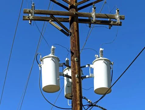 Electric transformers on pole. Stock Photos