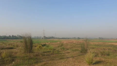 Electric transmission tower on a green open field at Baraipur. Stock Footage 236512444