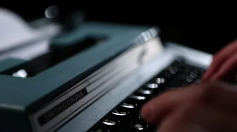 Electric typewriter hand typing jib up 1 Stock Footage 47460964
