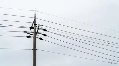 Electric Utility Pole with Power Lines and Insulators on a White Sky Stock Photos