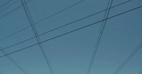 Electric utility tower power lines criss crossing the landscape Stock Footage 74676893