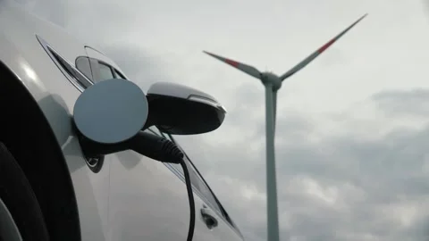 Electric Vehicle charging windmill background Stockbeeldmateriaal 336337229
