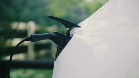 Electric Vehicle, Ev, Ev Charging, Plugging In Stock Footage 327947450