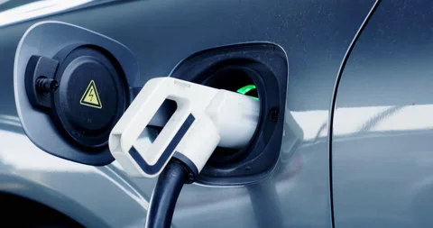 Electric vehicle plug-in charging cable pump EV car with modern technology UI Stock Footage 169396673