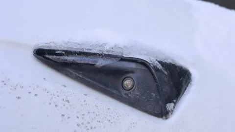 Electric Vehicle Side Camera Covered In Thick Winter Ice And Snow Stock Footage 329921058
