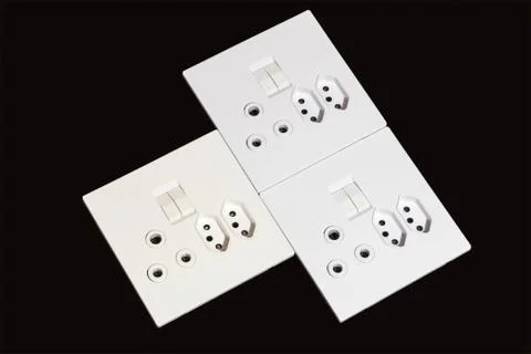 Electric Wall Mount Sockets and Switches on Black Background Stock Photos