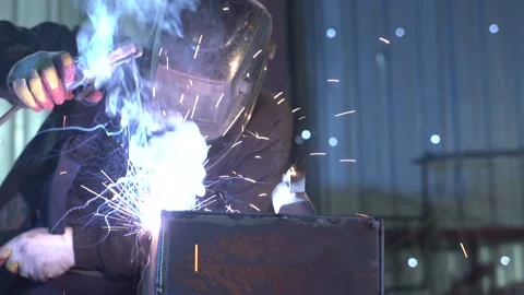 Electric wheel grinding on steel structure in factory Stock Footage 128805267