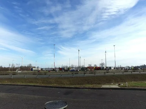 Electric windmill on highway,Hungary Stock Footage 76158297