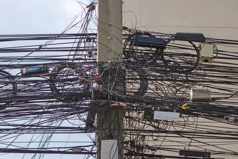 Electric wire or cable to be busy on electric pole Stock Photos