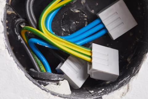 Electric wires in the wall Stock Photos