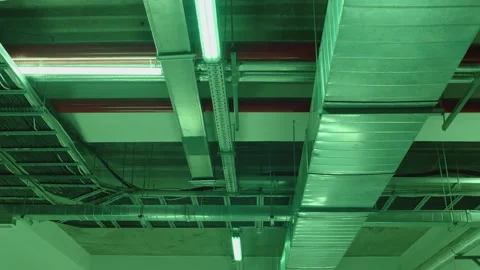 Electrical and air ventilation system communications with cables and metal pipes Stock Footage 199061094
