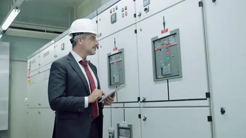 Electrical and Instrument technician checking electrical control board Stock Footage 153705114