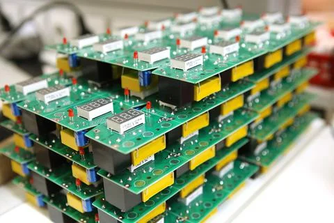 Electrical boards with parts for manual assembly of an electrical device. Dig Stock Photos