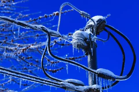 Electrical box installation with crystal icicles hanging from the wires. Weat Stock Photos