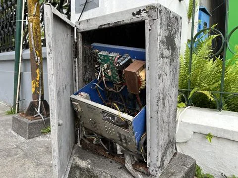 Electrical box of an old abandoned building on the street Stock Photos