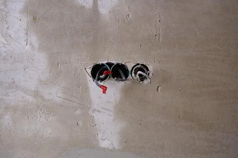 The electrical boxes for the wires are built into the wall, and the wires s.. Stock Photos