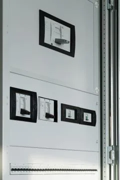 Electrical Cabinet with breakers closed protective panels Stock Photos