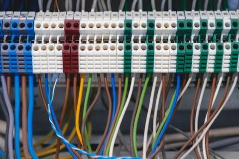 Electrical cabinet with multi-colored electric wires connected to automatic.. Foto stock