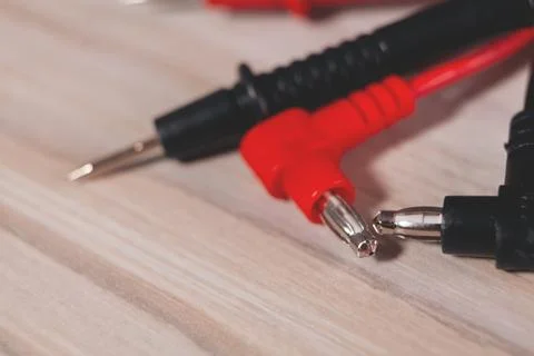 Electrical cable and plug in the shape of an electric socket. Stock Photos