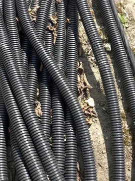 Electrical Cable Corrugated Protection on Ground in Outdoor Setting Stock Photos