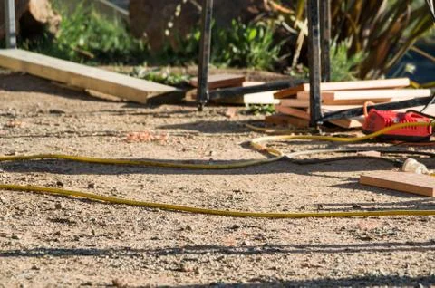 Electrical cable laying in the dirt on a construction site Stock Photos