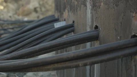The electrical cables are routed out of the wind turbine's concrete foundation 库存影片 347411238