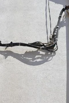 Electrical cables on a house wall Stock Photos