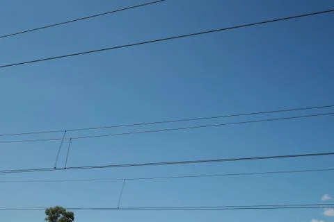 Electrical cables overhead with blue sky Stock Photos