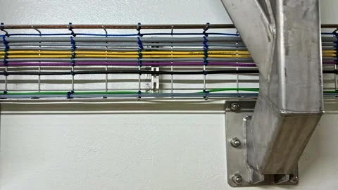 Electrical cables running in wire mesh tray system with metal support Stock Footage 332455731