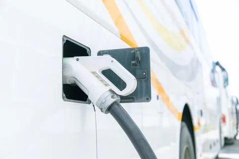 A electrical car in charging position connected to charging piles Stock Photos