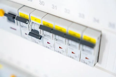 Electrical circuit breaker panel with switched breakers inside a residential Stock Photos
