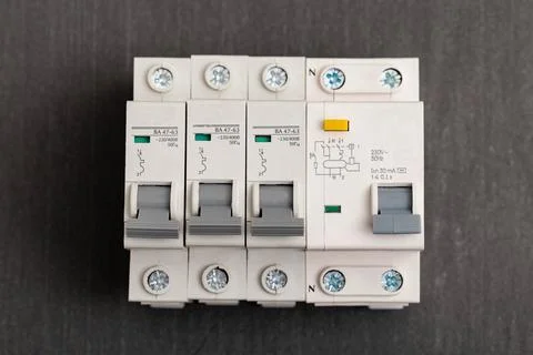 Electrical circuit breakers on a gray background, close-up. Designed for Photos